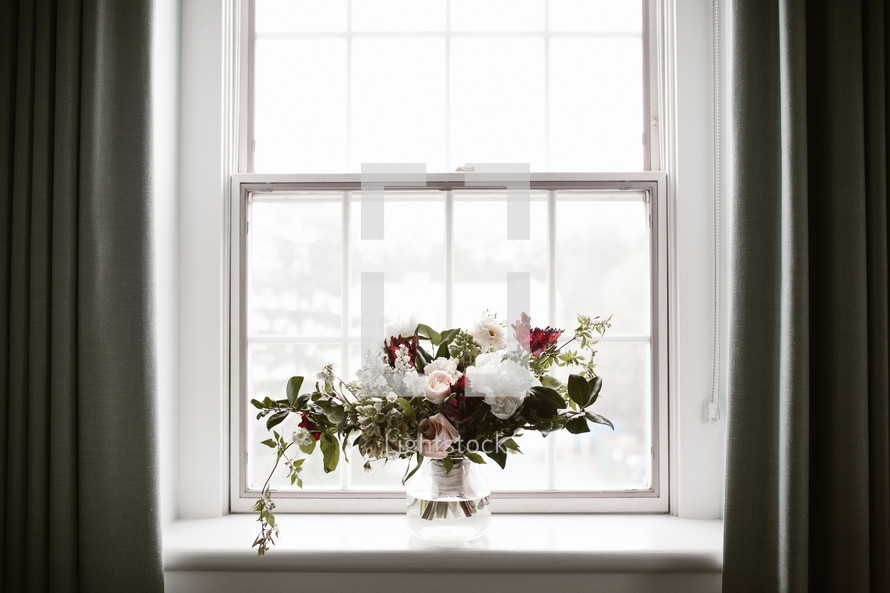 flower arrangement in a window sill 