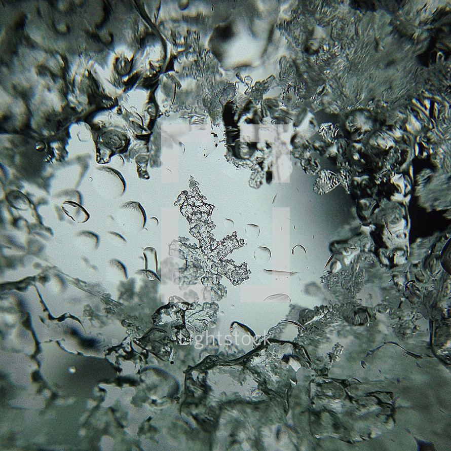 snowflake and ice closeup on a window