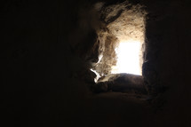 Light shining through a thick stone wall.
