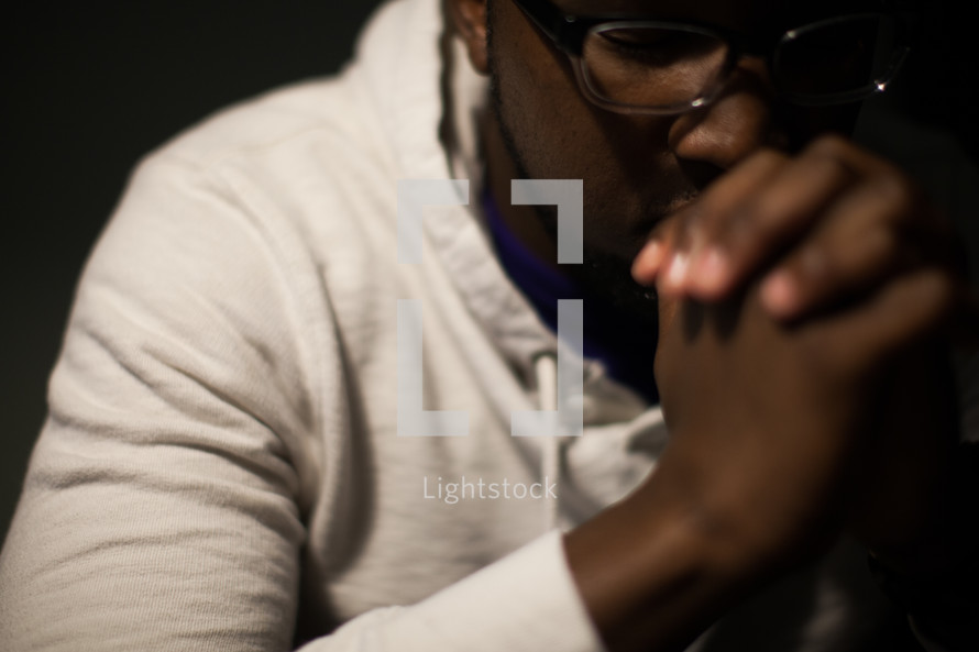 African-american man with praying hands — Photo — Lightstock