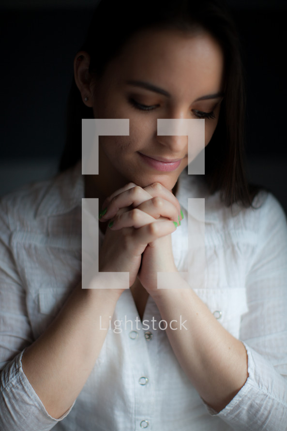 brunette woman in prayer 