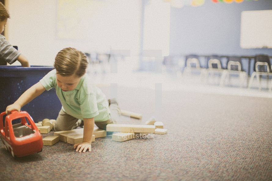 child playing with blocks 