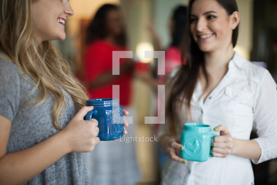 women in conversation and drinking coffee at a women's group 
