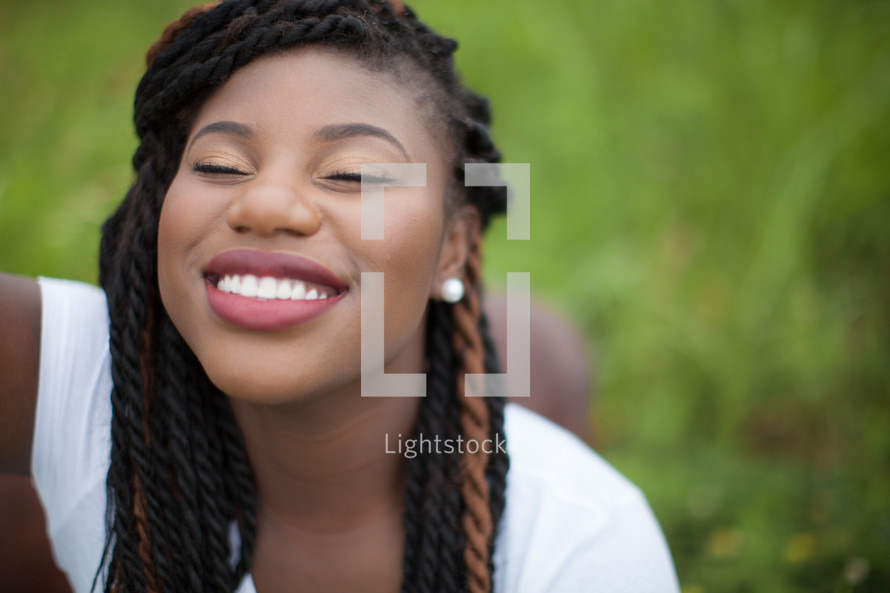 joyful woman in prayer with face turned to God 