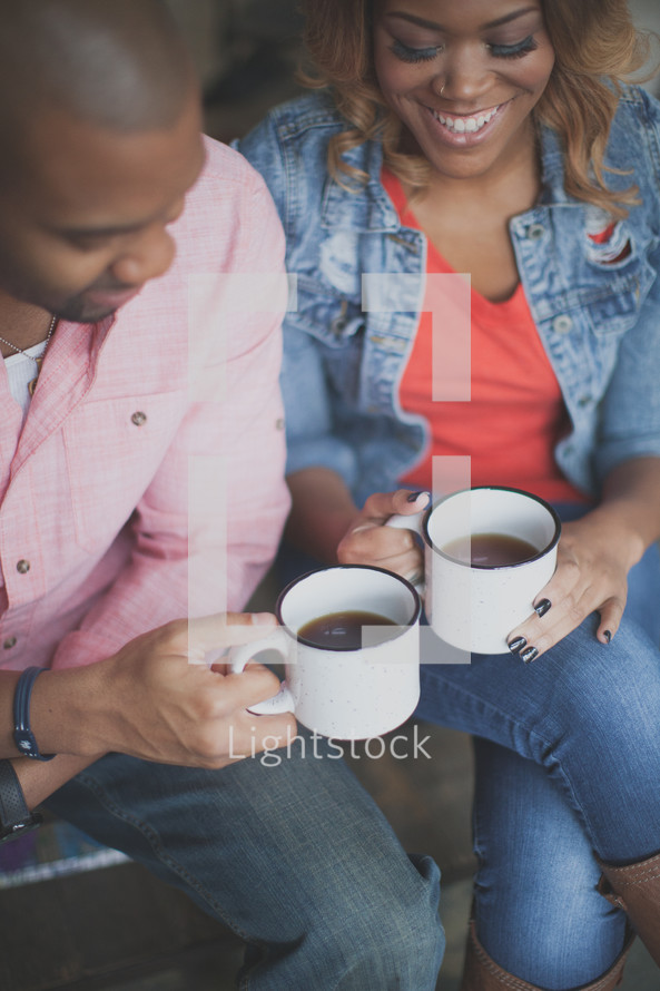African American couple drinking coffee together 