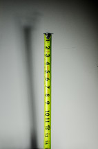 A tape measure going up to 15 inches.