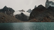 Laguna de los Tres Calm Blue Water With Scenic Views Of Fitz Roy Mountain In Patagonia, Argentina. - wide shot