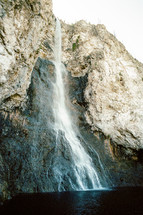 waterfall off the side of a cliff 