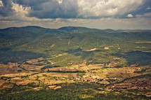 aerial view over a green mountainous landscape 