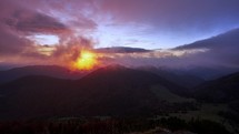 Sunrise in the mountains,clouds spill over the peaks of hills in the Carpathian.Panoramatic timelapse. 
