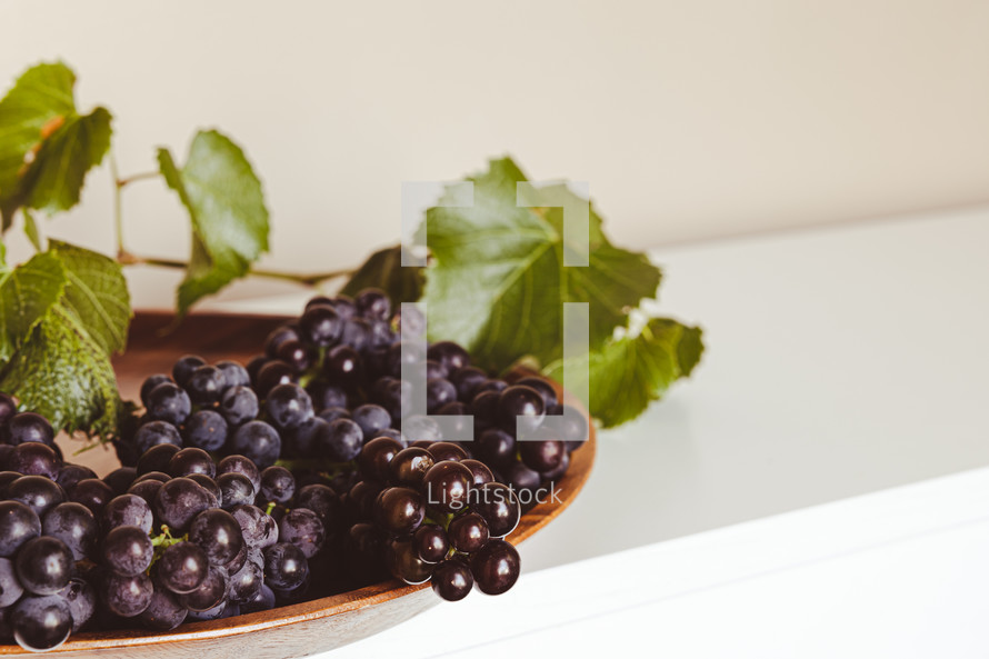 grapes on a teak tray 