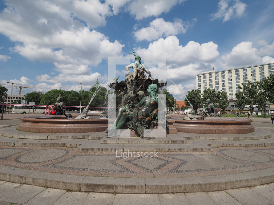 BERLIN, GERMANY - JUNE 03, 2016: The Neptunbrunnen (Neptune fountain) in Alexanderplatz was designed by german sculptor Reinhold Begas in 1891