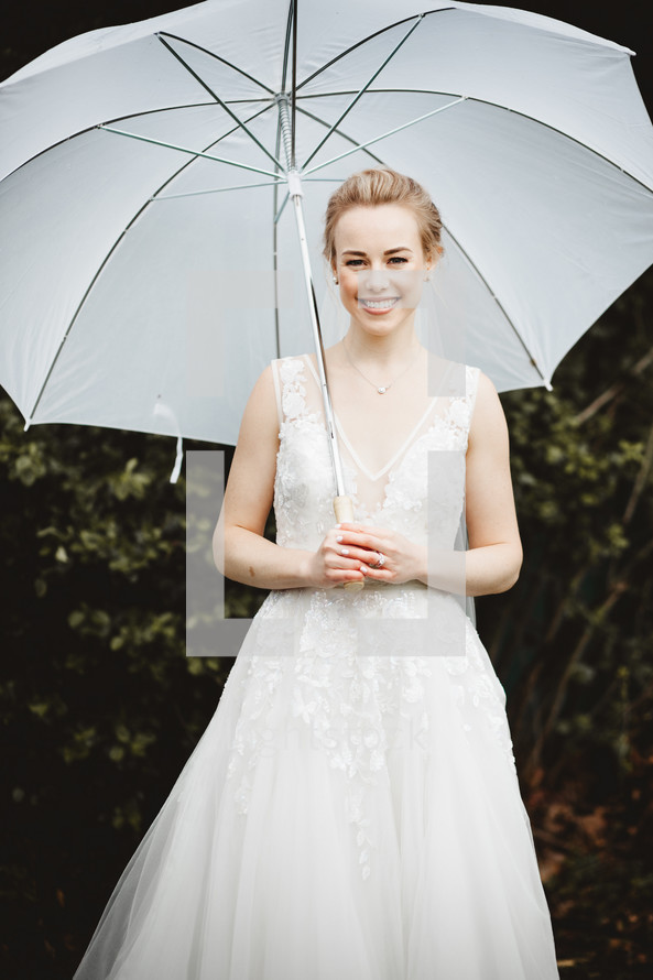 bride holding an umbrella 