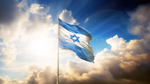 Israel flag fluttering in the wind on a hill at sunrise. God rays and clouds after storm. Victory concept