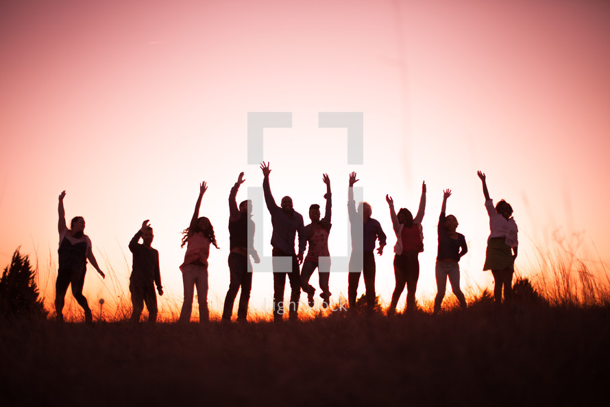 jumping, raised hands, praise, man, woman, silhouettes, group, people, row, standing, field, outdoors, worship 