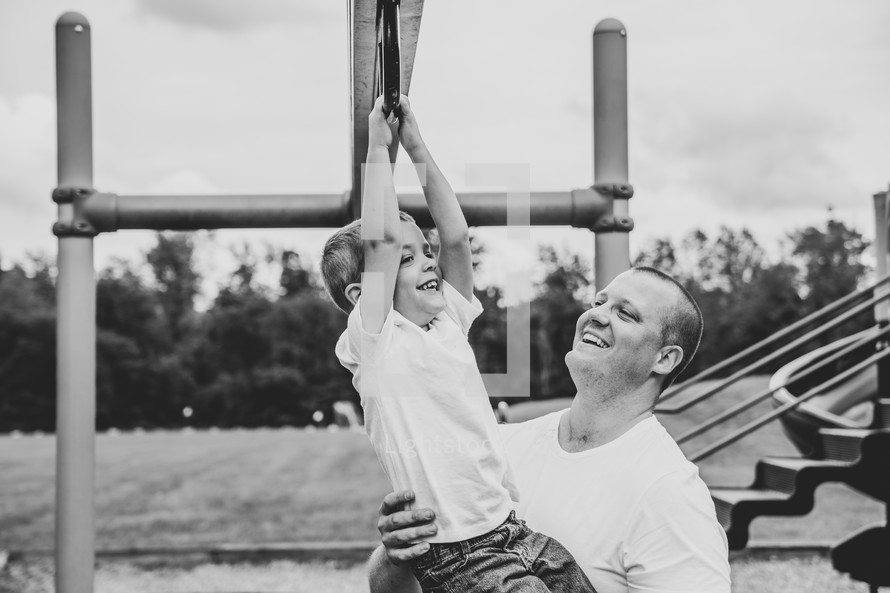 father and son on a playground 