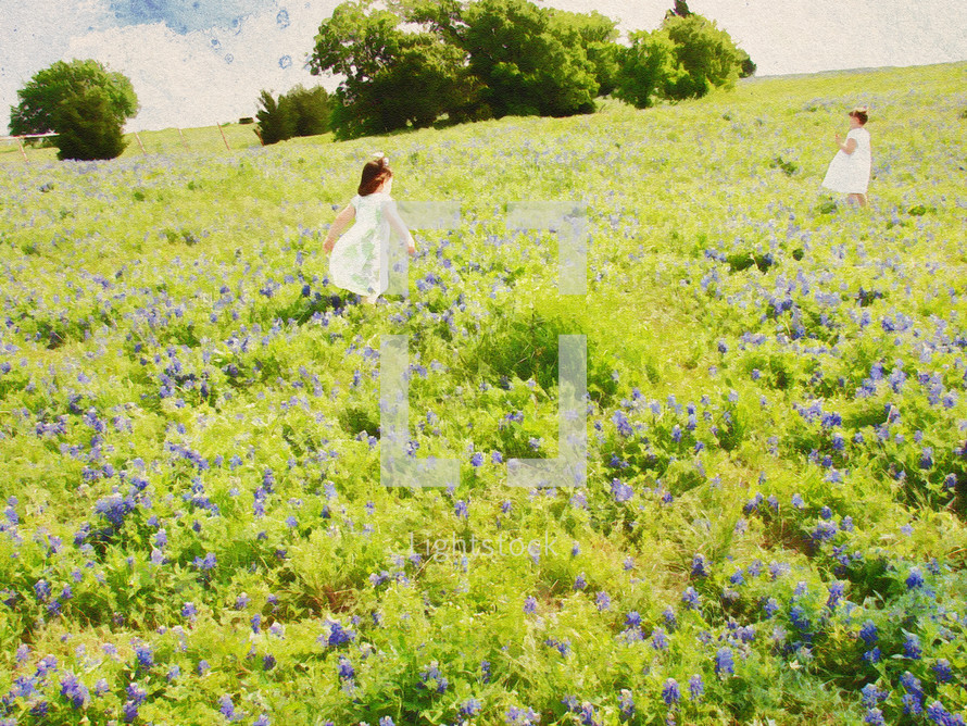 girls on a hillside covered with blooming bluebonnet plants with an art effect