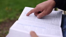 Asian Man Reading Bible Tracing With Finger Close Up Hands