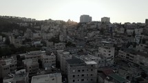Middle eastern city drone shot of homes aerial war zone conflict Israel.