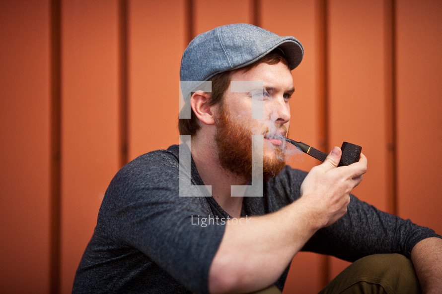 man smoking a pipe