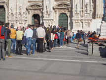 MILAN, ITALY - MARCH 28, 2015: Tourists in the Piazza Duomo square in front of Milan Cathedral church