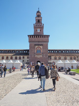 MILAN, ITALY - MARCH 28, 2015: People visiting the Sforza Castle aka Castello Sforzesco which is the oldest castle in town
