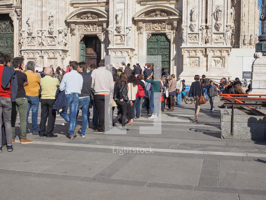 MILAN, ITALY - MARCH 28, 2015: Tourists in the Piazza Duomo square in front of Milan Cathedral church