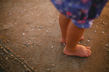 toddler feet in the sand on a beach 
