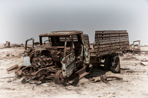 rusty abandoned truck in a desert 