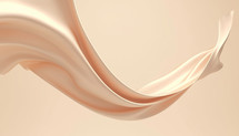 floating swirl of soft peachy tan silken fabric with copy space