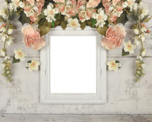 old frame surrounded by flowers 