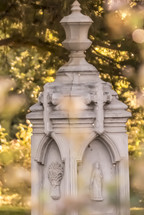 defocused grave monument with bokeh effects