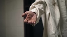 Jesus Christ offers his helping hand for salvation.