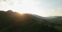 Golden Sunrise Over Forest Mountain Near Palanca Village In Bacau County, Western Moldavia, Romania. Aerial Wide Shot
