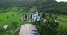 Aerial View Of An Ancient Church And Cemetery In Palanca, Bacau County, Western Moldavia, Romania.