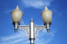 street lamp against a blue sky 