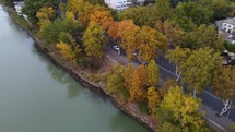 Traffic and autumn colors by the river