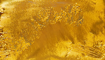 abstract background on gold paint texture on flat surface