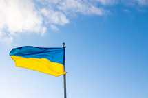 Ukrainian flag on a flag pole 
