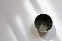 bowl of ashes on white background 