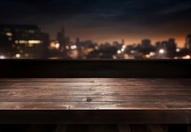 Empty wooden table and blurred city at night background, product display montage