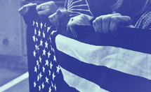 hands holding an American flag 