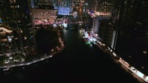 Reveal Shot of Miami River and Downtown City Skyline at Night.
