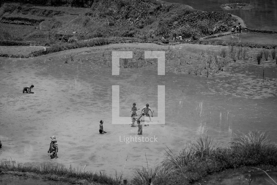 children playing on a shore in Luwuk 