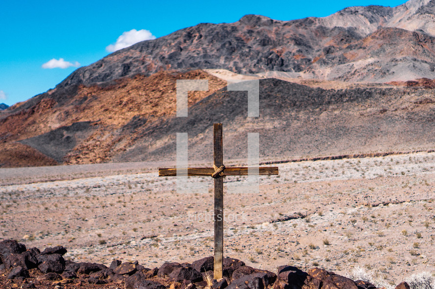cross in a desert landscape 