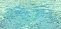 turquoise and blue green rippling water surface
