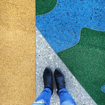 standing on colored tiles 