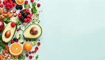 Healthy food concept. Assortment of fresh fruits, berries and nuts on color background