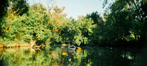 man kayaking on a river 