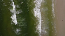 aerial view over tide on a shore 